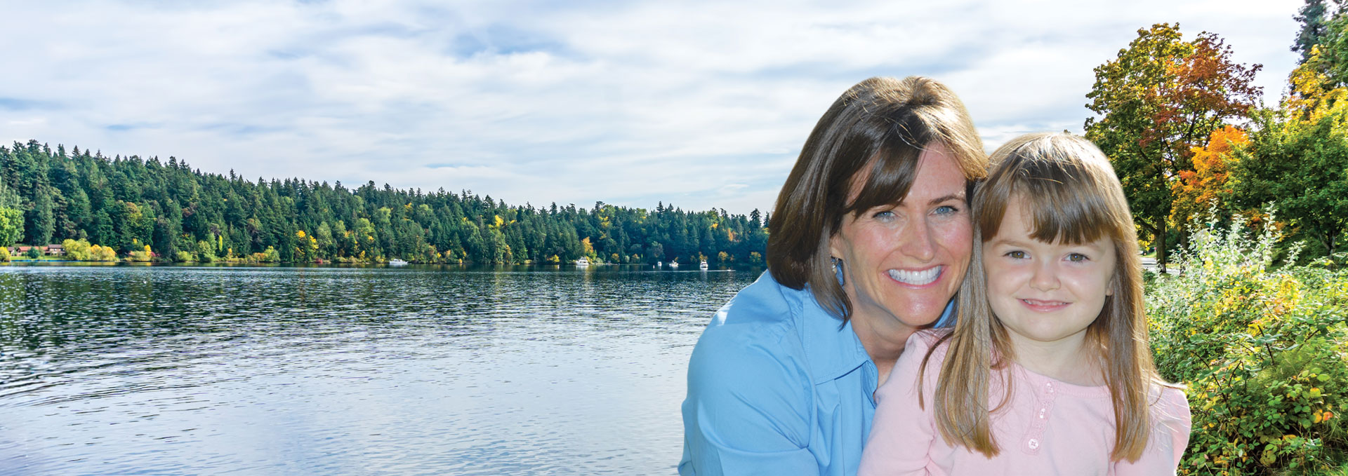 mother and daughter by a lake