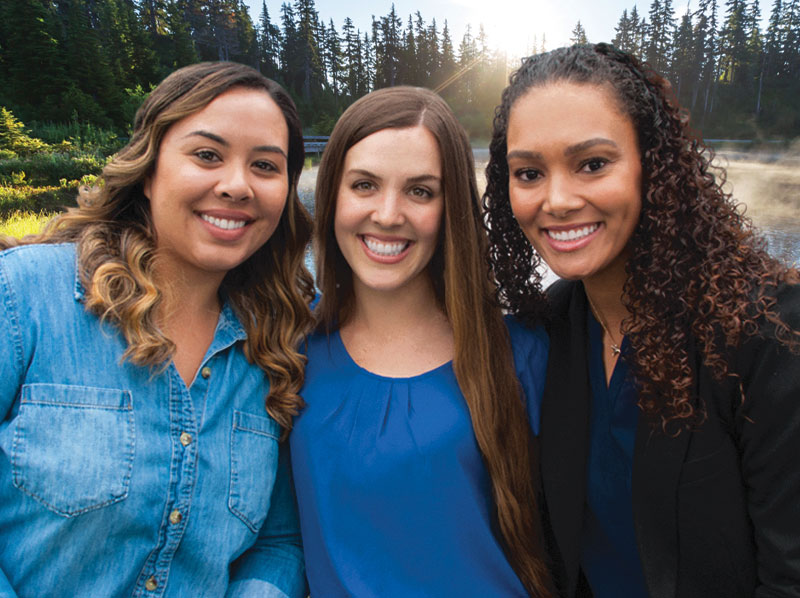three smiling ladies